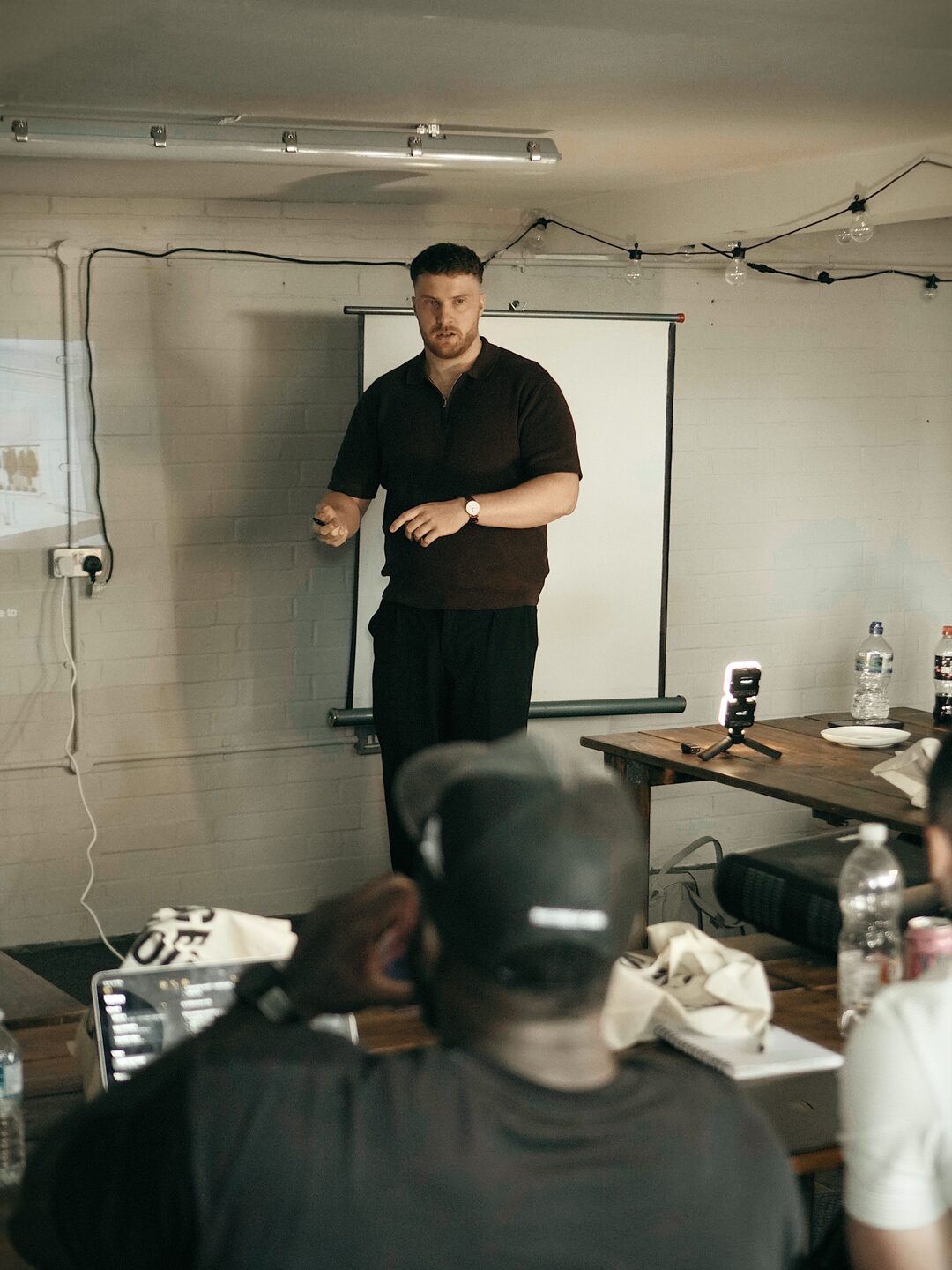 Charlie Beestone speaking to a team, audience seated in the room